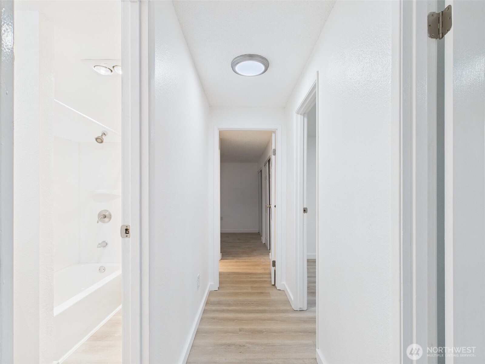 32142 46th Place Southwest, Unit M6 Federal Way, WA 98023 - Photo 10 of 29 a view of a hallway with wooden floor