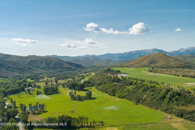 a view of a small yard and mountain view