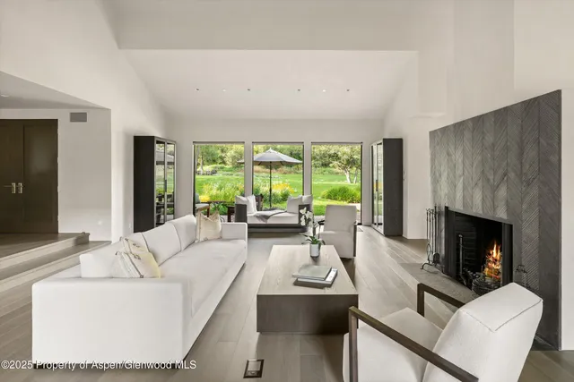 a bathroom with a toilet a sink and a window