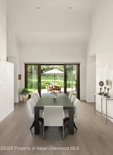 a bedroom with a large bed and a large window