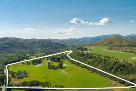 a view of mountain with an ocean