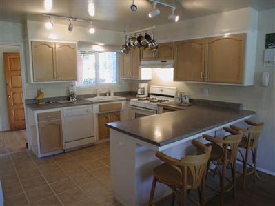 319 Mecham Road Petaluma, CA 94952 - Photo 6 of 12 a kitchen with a table chairs sink and cabinets