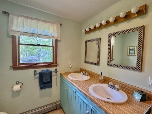 113 Leonard Circle Tisbury, MA 02568 - Photo 14 of 25 a bathroom with a granite countertop sink and a mirror