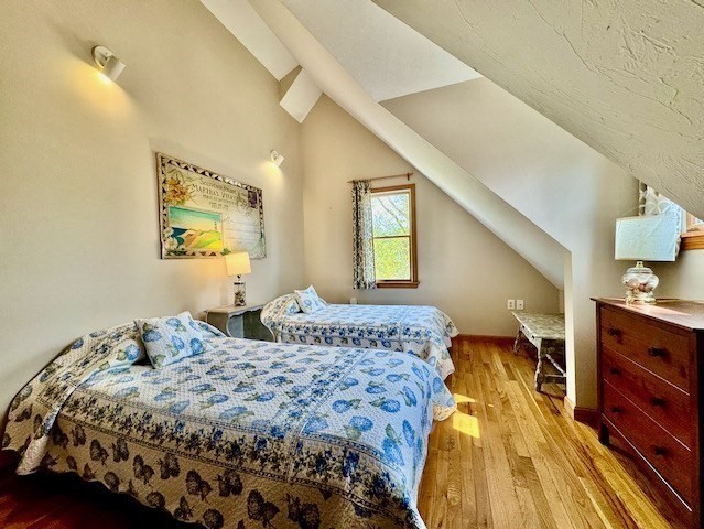 113 Leonard Circle Tisbury, MA 02568 - Photo 16 of 25 a bedroom with a bed and a dresser