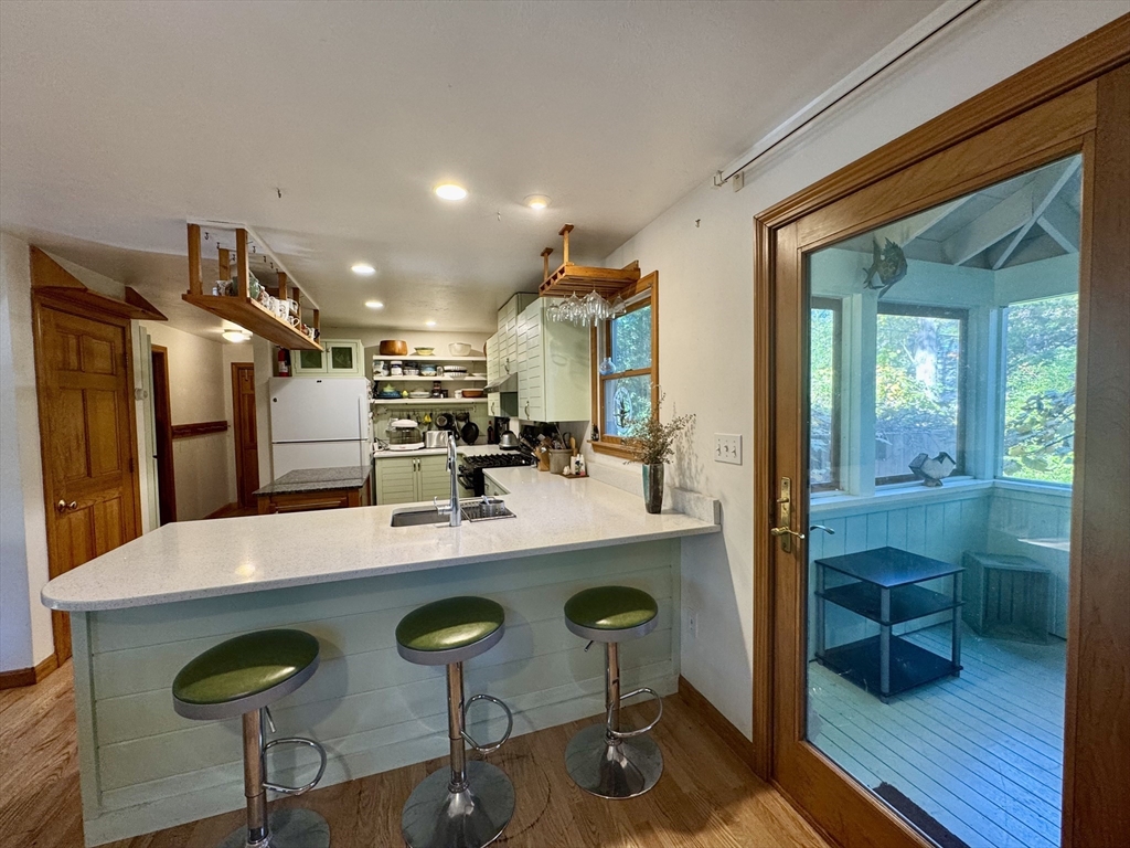 113 Leonard Circle Tisbury, MA 02568 - Photo 19 of 25 a view of a table and chairs in a room