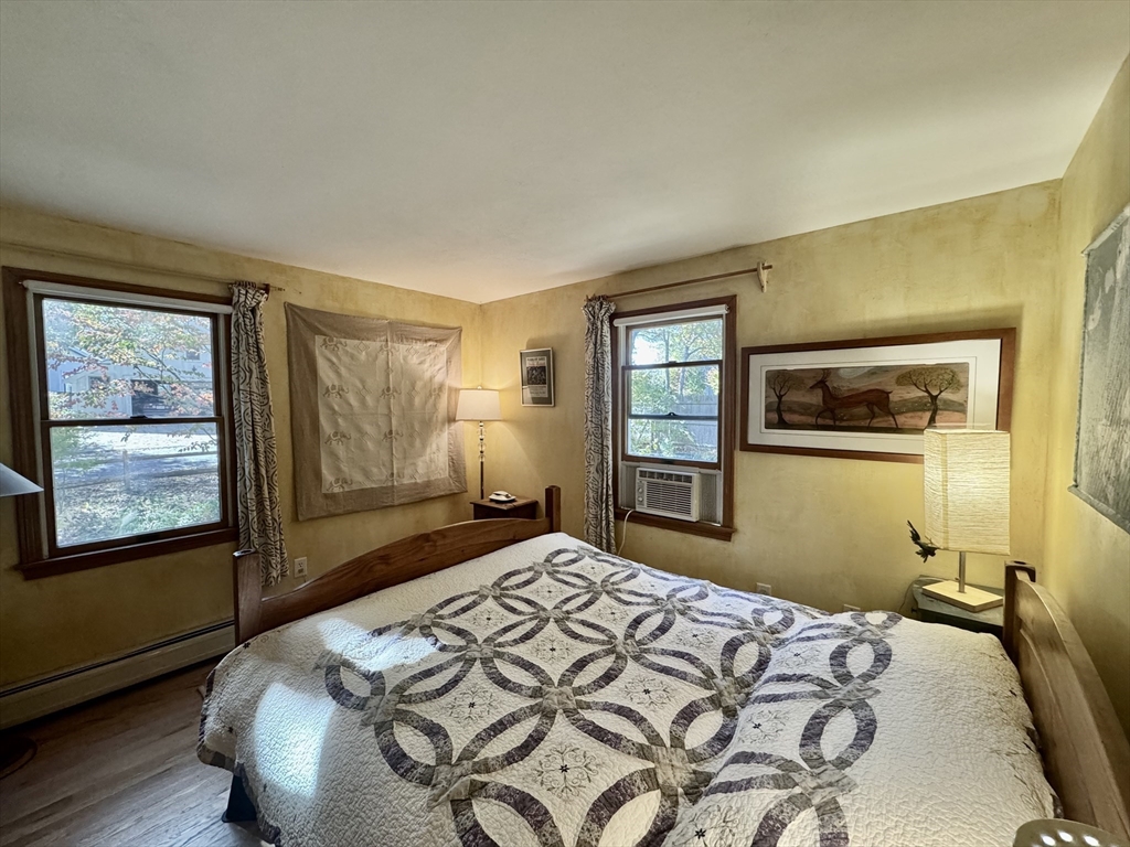 113 Leonard Circle Tisbury, MA 02568 - Photo 21 of 25 a bedroom with a bed and a window