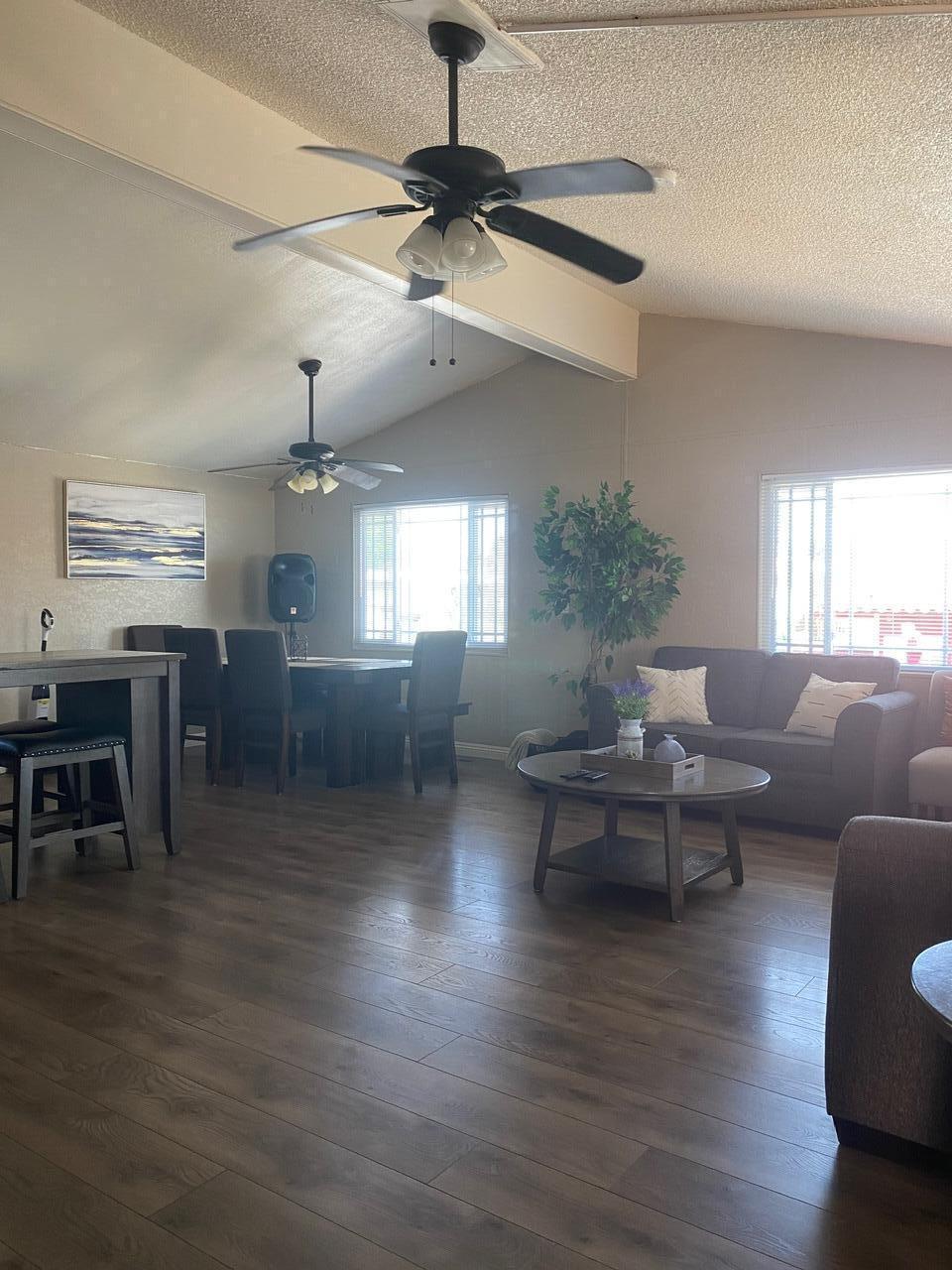 8300 Kern Canyon Road Bakersfield, CA 93306 - Photo 5 of 10 a living room with furniture or kitchen and a wooden floor