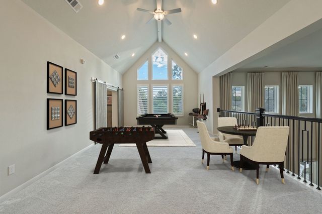 a living room with furniture a table and a large window