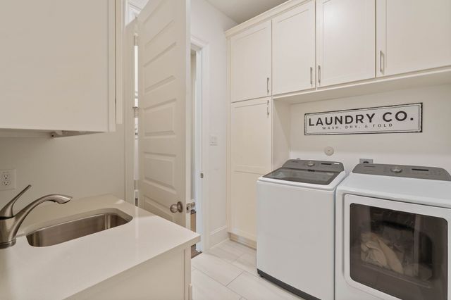 a view of a utility room with dryer and washer