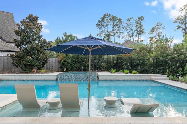 a view of a patio with furniture and backyard