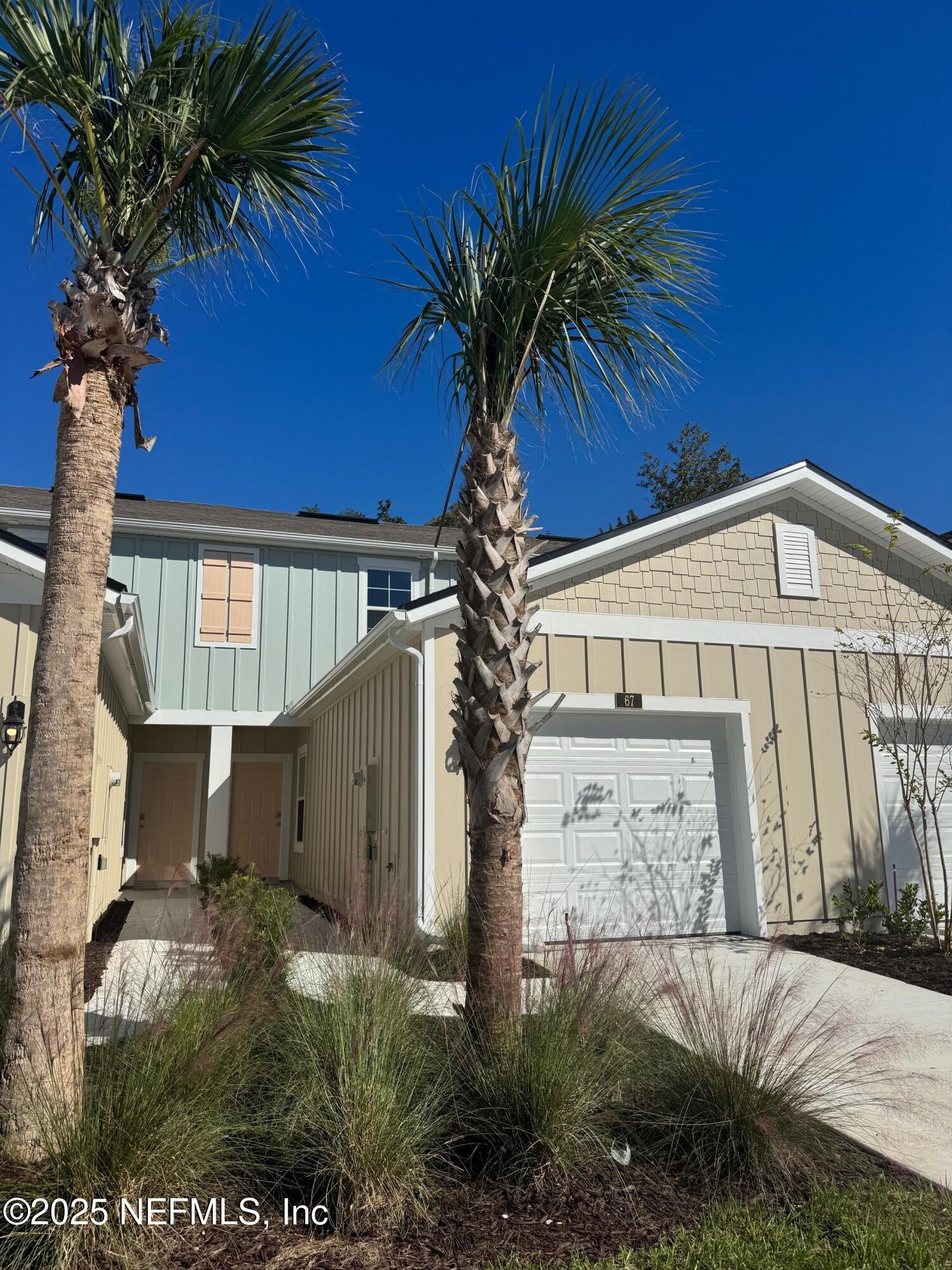 67 Blue Hvn Road St. Augustine, FL 32095 - Photo 2 of 58 a view of a house with a yard