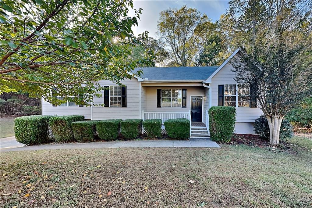 132 Hickory View Lane Acworth, GA 30101 - Photo 1 of 23 a front view of a house with garden
