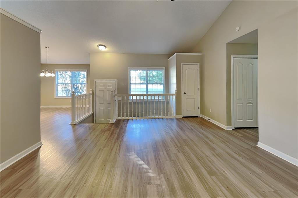 132 Hickory View Lane Acworth, GA 30101 - Photo 3 of 23 an empty room with wooden floor and windows