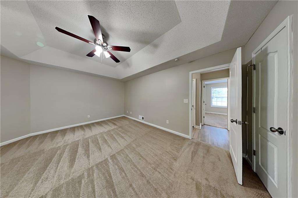132 Hickory View Lane Acworth, GA 30101 - Photo 7 of 23 a view of a livingroom with a ceiling fan & hardwood floor