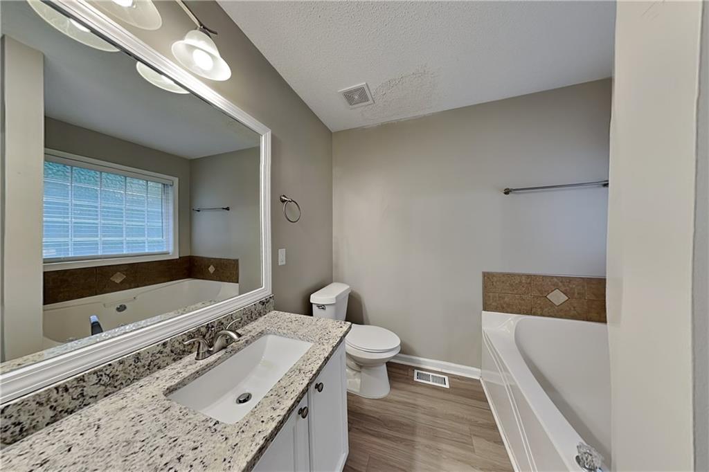 132 Hickory View Lane Acworth, GA 30101 - Photo 10 of 23 a bathroom with a sink a toilet and bathtub