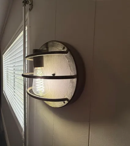 a white toilet sitting next to a shower curtain
