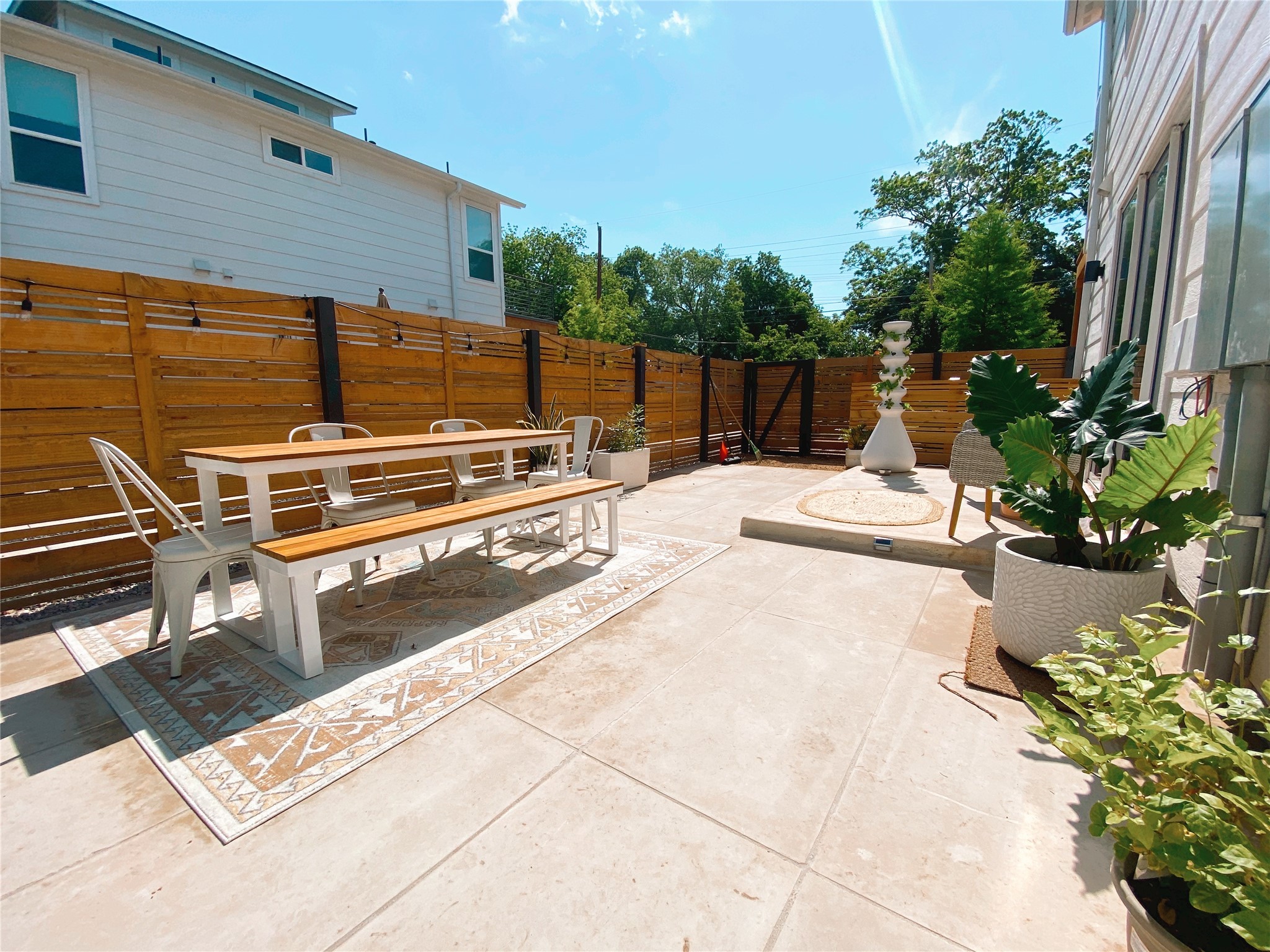 1106 Walton Lane, Unit B Austin, TX 78721 - Photo 13 of 28 Fenced backyard featuring a patio area and outdoor dining space