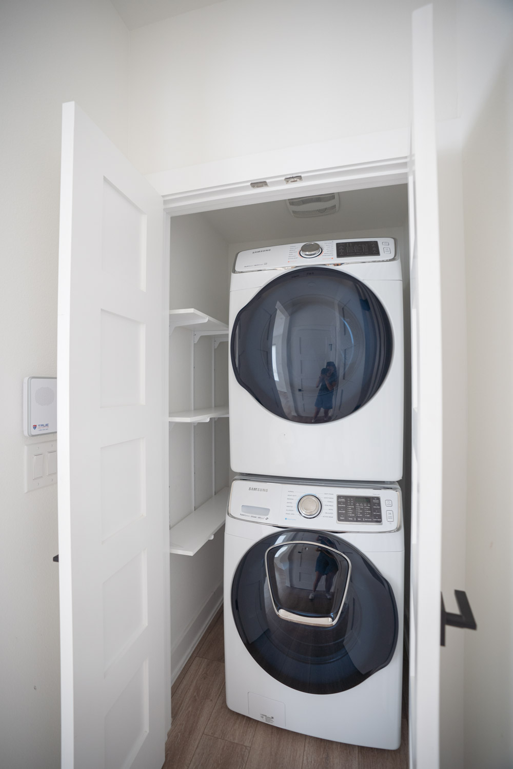 1106 Walton Lane, Unit B Austin, TX 78721 - Photo 24 of 28 Laundry area with stacked washing machine