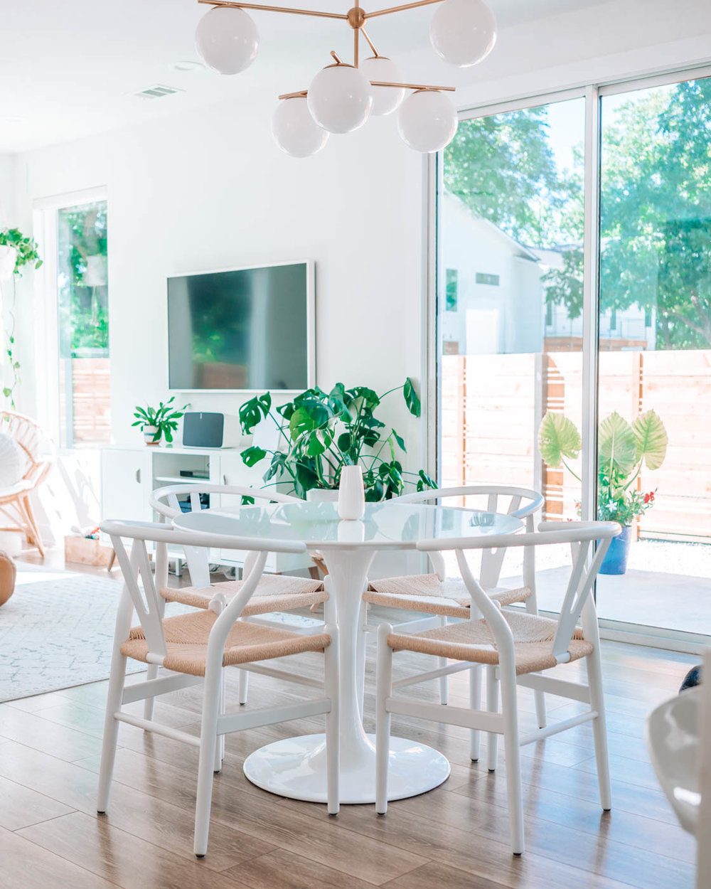 1106 Walton Lane, Unit B Austin, TX 78721 - Photo 9 of 28 Dining area with light wood finished floors and a chandelier