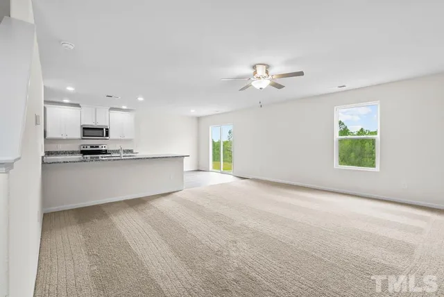 a view of a kitchen with an empty space and a kitchen