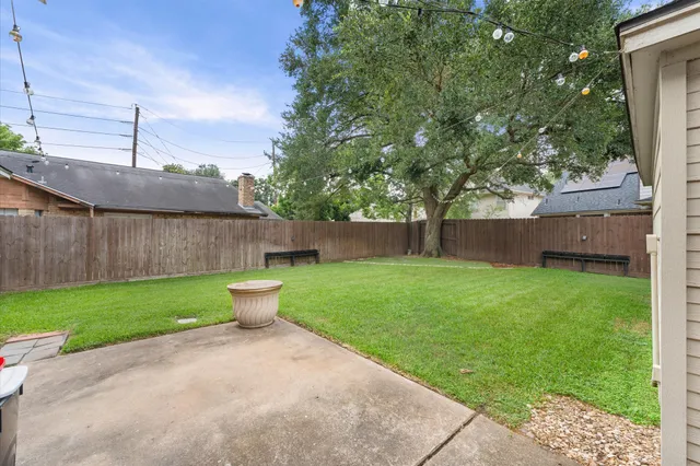 a view of a backyard with barn and a garden