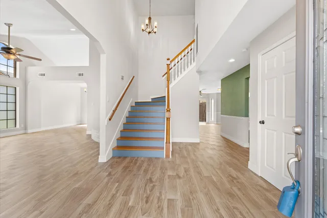 a view of entryway with wooden floor and stairs
