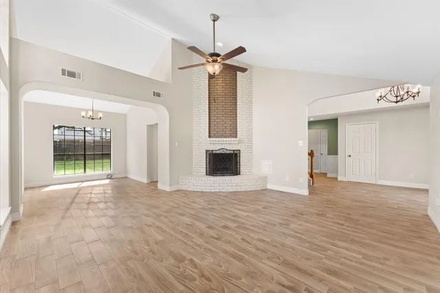 a view of an empty room with glass door