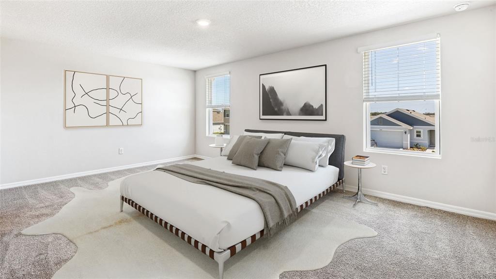 3310 Bitterroot Lane Lakewood Ranch, FL 34211 - Photo 13 of 38 a bedroom with a bed and a window