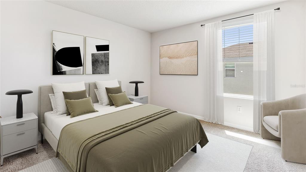 3310 Bitterroot Lane Lakewood Ranch, FL 34211 - Photo 15 of 38 a bedroom with a bed and glass door