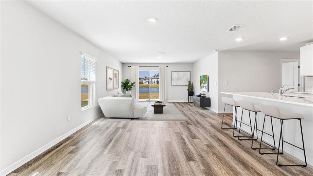 3310 Bitterroot Lane Lakewood Ranch, FL 34211 - Photo 2 of 38 a view of a living room with a large window