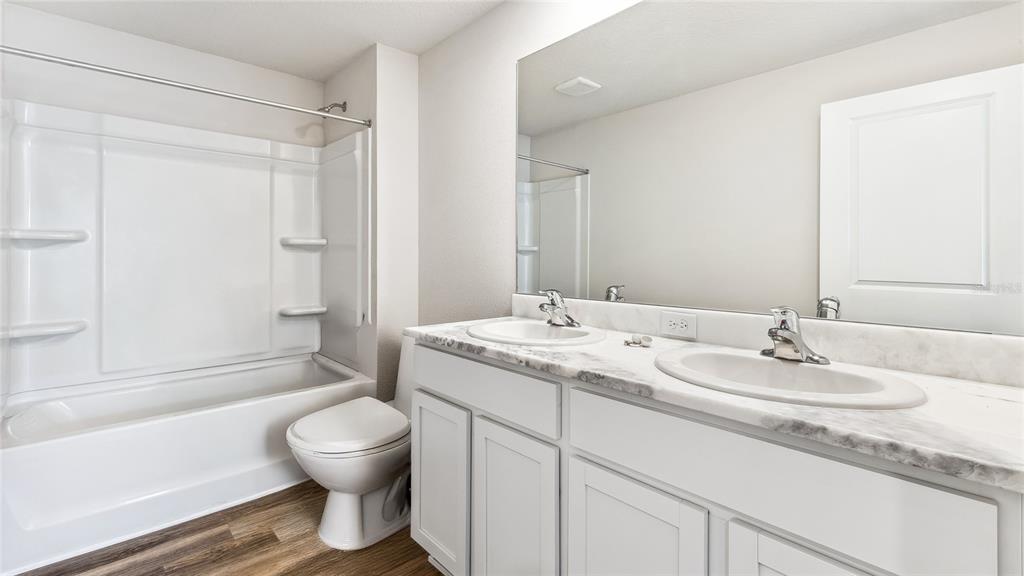 3310 Bitterroot Lane Lakewood Ranch, FL 34211 - Photo 21 of 38 a bathroom with a sink and a mirror