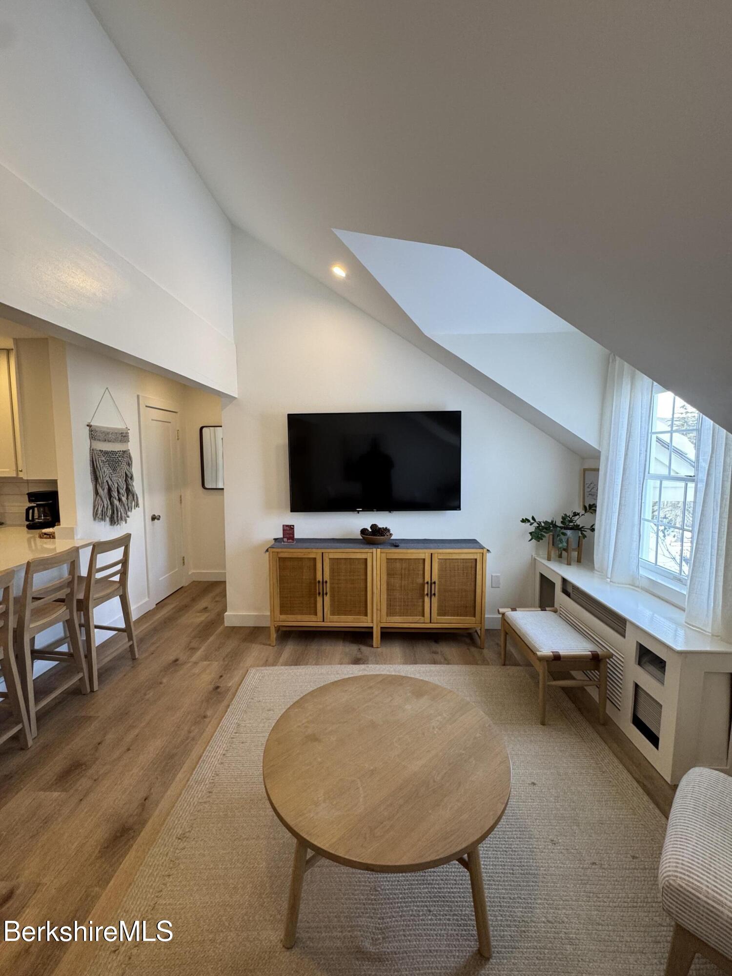 803 Crane Hancock, MA 01237 - Photo 19 of 24 a living room with furniture and a flat screen tv