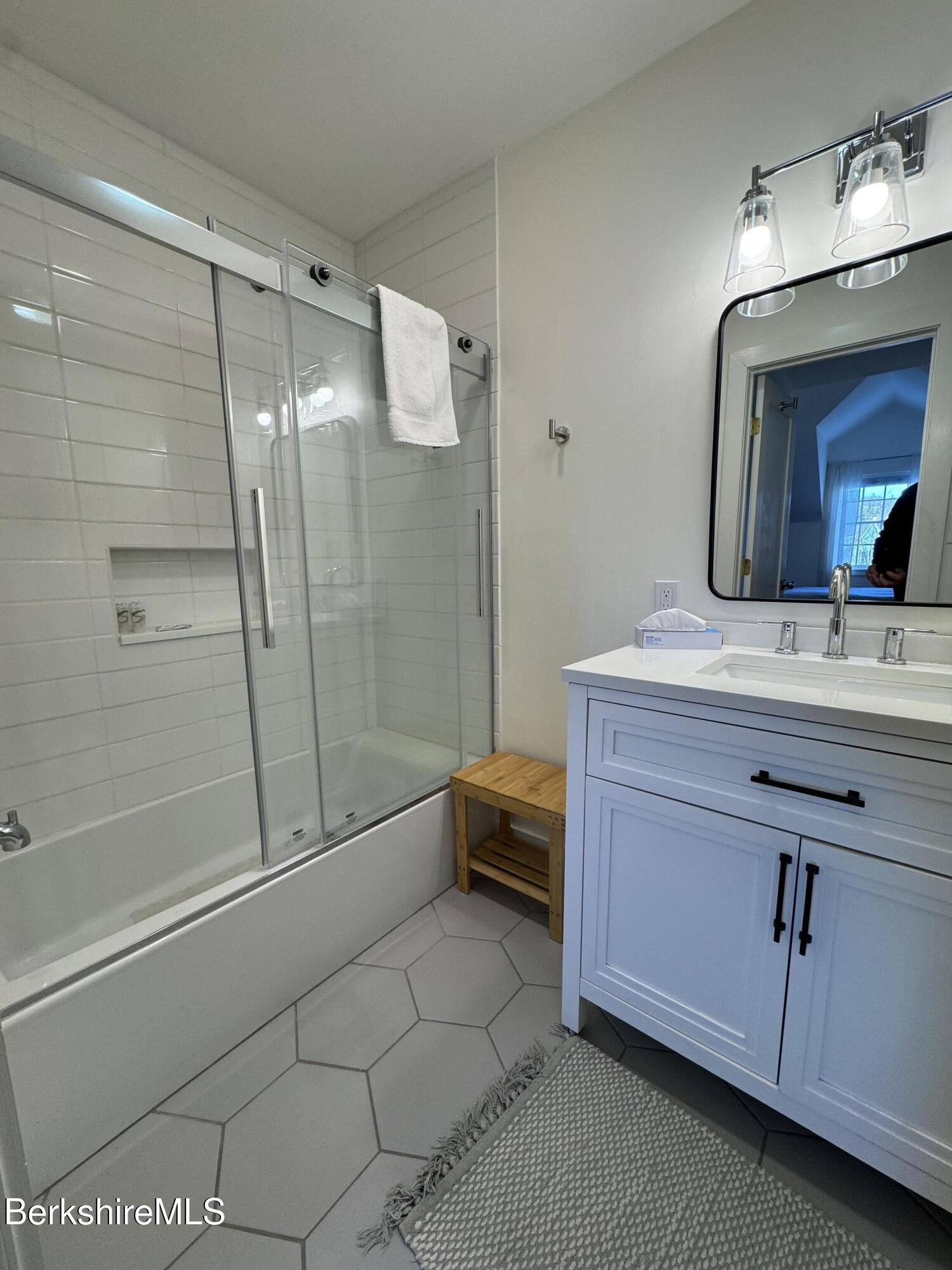 803 Crane Hancock, MA 01237 - Photo 23 of 24 a bathroom with a double vanity sink toilet and shower