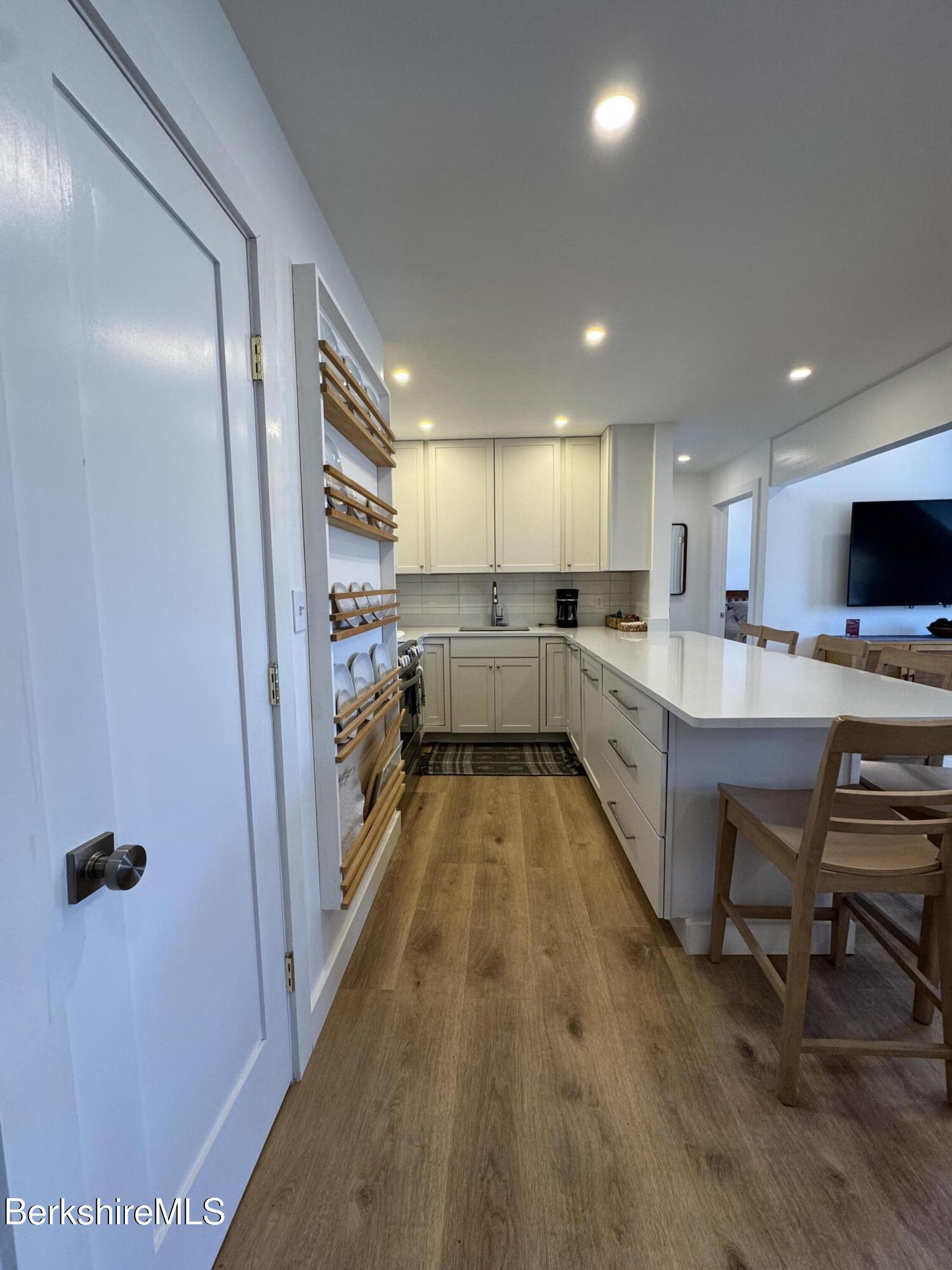 803 Crane Hancock, MA 01237 - Photo 8 of 24 a kitchen with a refrigerator and a sink