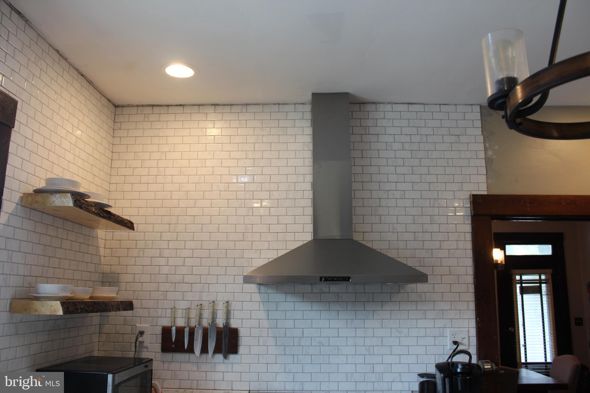 19518 Hyde Road Southwest Barton, MD 21521 - Photo 10 of 40 subway tile and stainless range hood