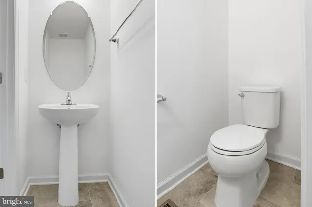 a bathroom with a sink toilet and a mirror