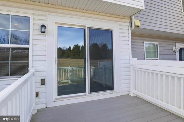 a view of a door and a window