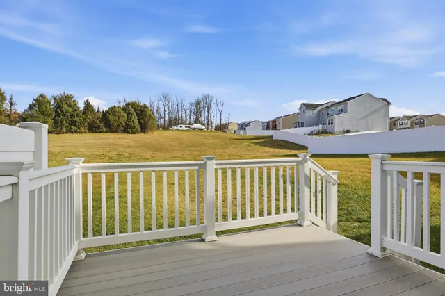 a view of a balcony with wooden floor