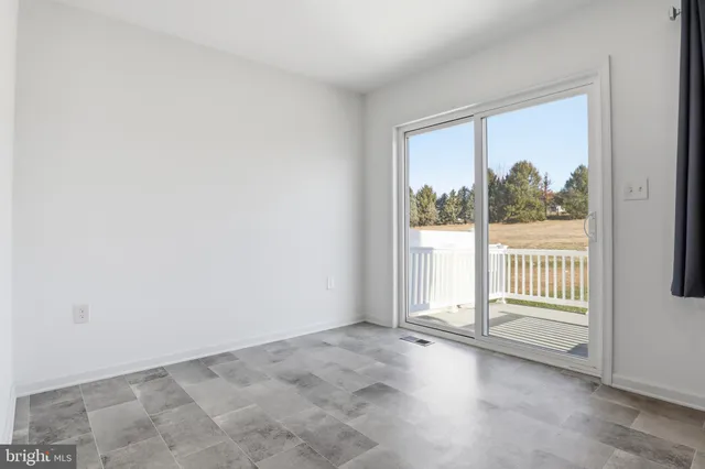 an empty room with a large window