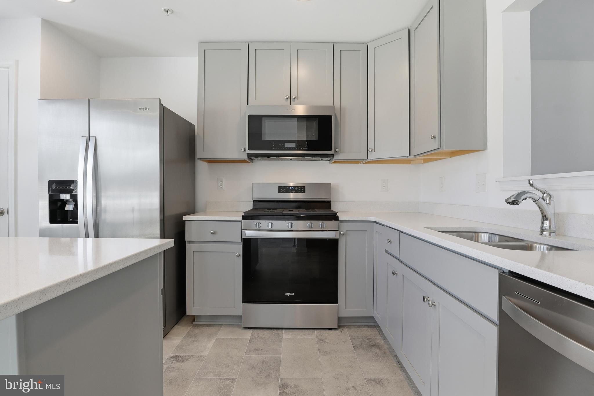 202 Homestead Drive Hanover, PA 17331 - Photo 9 of 29 a kitchen with stainless steel appliances granite countertop a sink stove and refrigerator