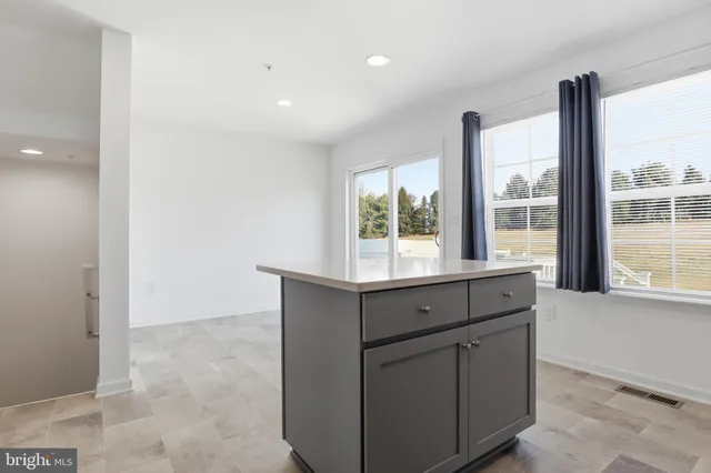 a room with window and cabinet