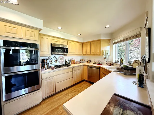 a kitchen with sink a stove and cabinets