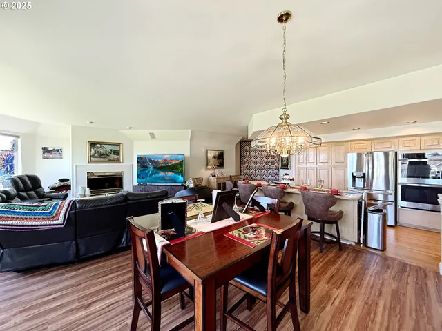 a living room with lots of furniture and a wooden floor