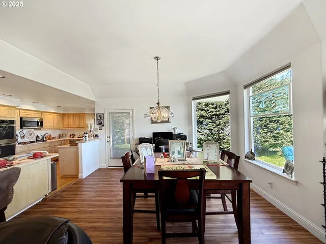 a view of a dining room with furniture window and outside view