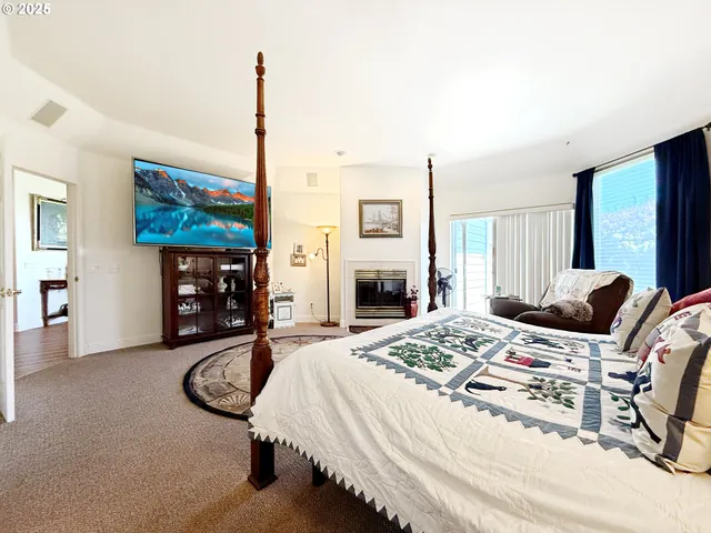 a bedroom with a bed a couch and dresser