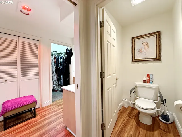 a bathroom with a toilet and a shower curtain