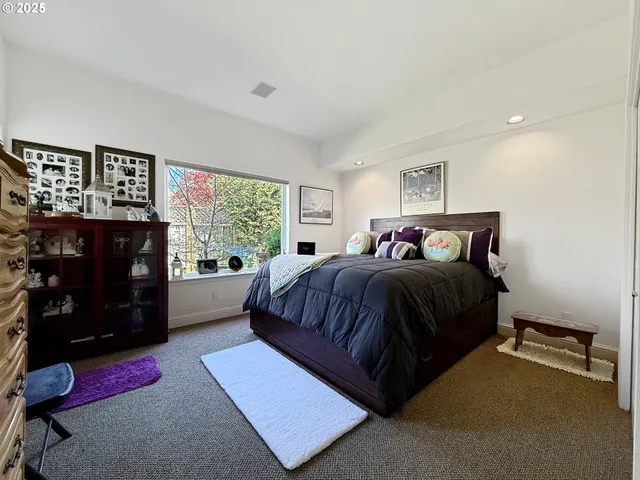 a bedroom with a bed and window