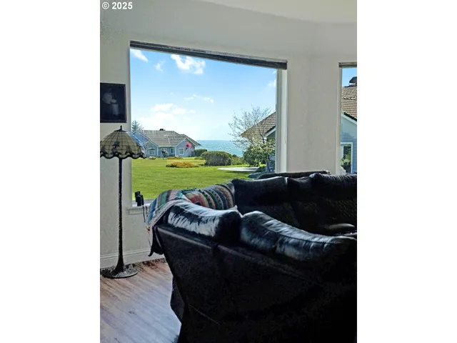 a living room with furniture and a yard