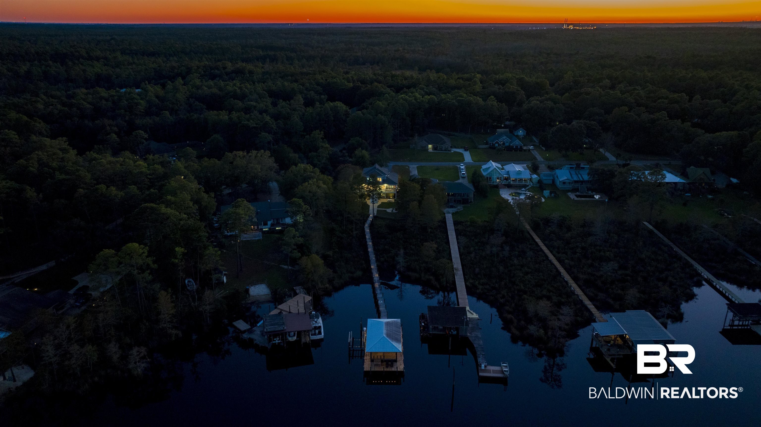 11463 Getchell Drive Theodore, AL 36582 - Photo 39 of 39 Aerial view at dusk featuring a water view