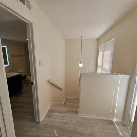 a view of entryway with wooden floor